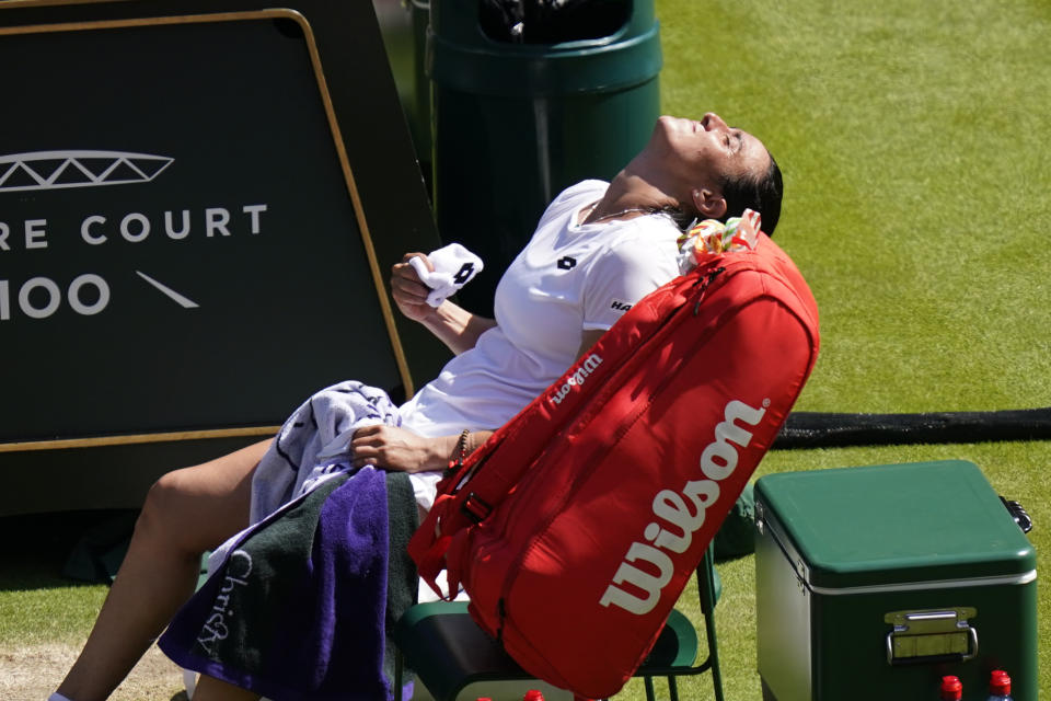 Tunisia's Ons Jabeur reacts after winning against Germany's Tatjana Maria in a women's singles semifinal match on day eleven of the Wimbledon tennis championships in London, Thursday, July 7, 2022. (AP Photo/Gerald Herbert)