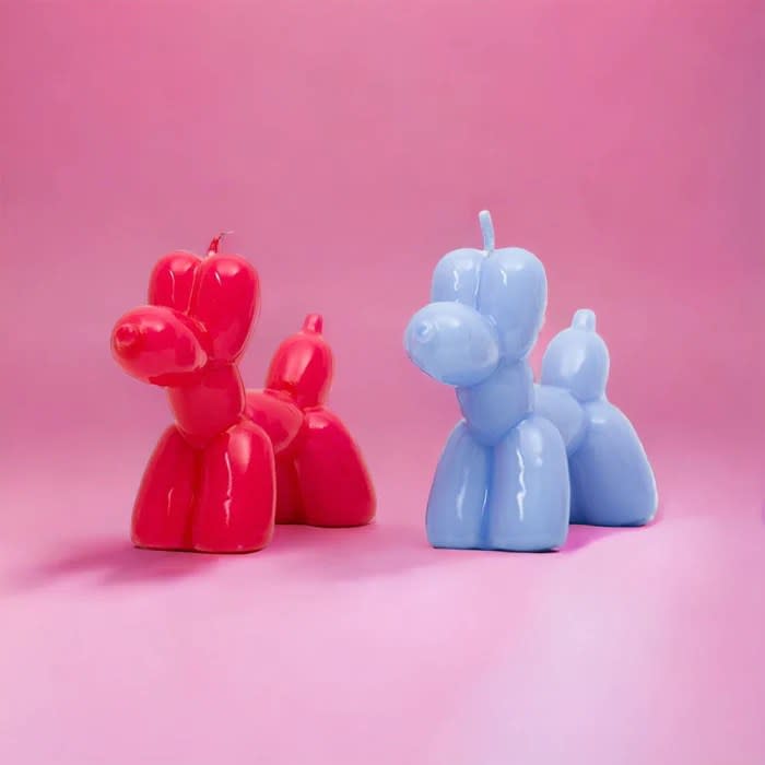 magenta and blue balloon dog-shaped candle