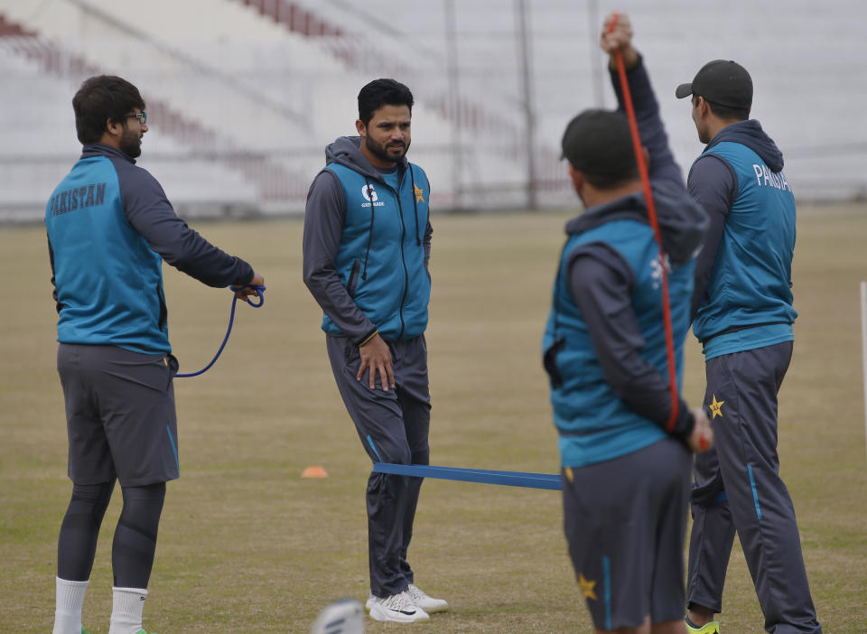 Pakistan's test team skipper Azhar Ali, center, and others attend a training session for the upcoming 1st test match against Bangladesh, at Pindi Stadium in Rawalpindi, Pakistan, Tuesday, Feb. 4, 2020. (AP Photo/Anjum Naveed)