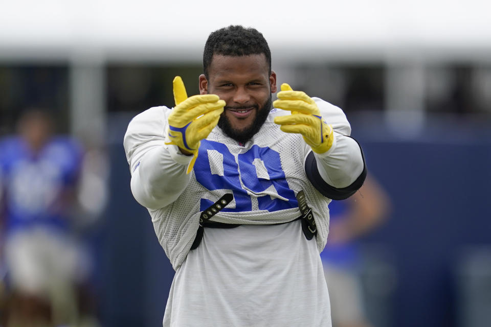 Los Angeles Rams defensive tackle Aaron Donald (99) participates in drills at the NFL football team's practice facility in Irvine, Calif. Thursday, Aug. 4, 2022. (AP Photo/Ashley Landis)