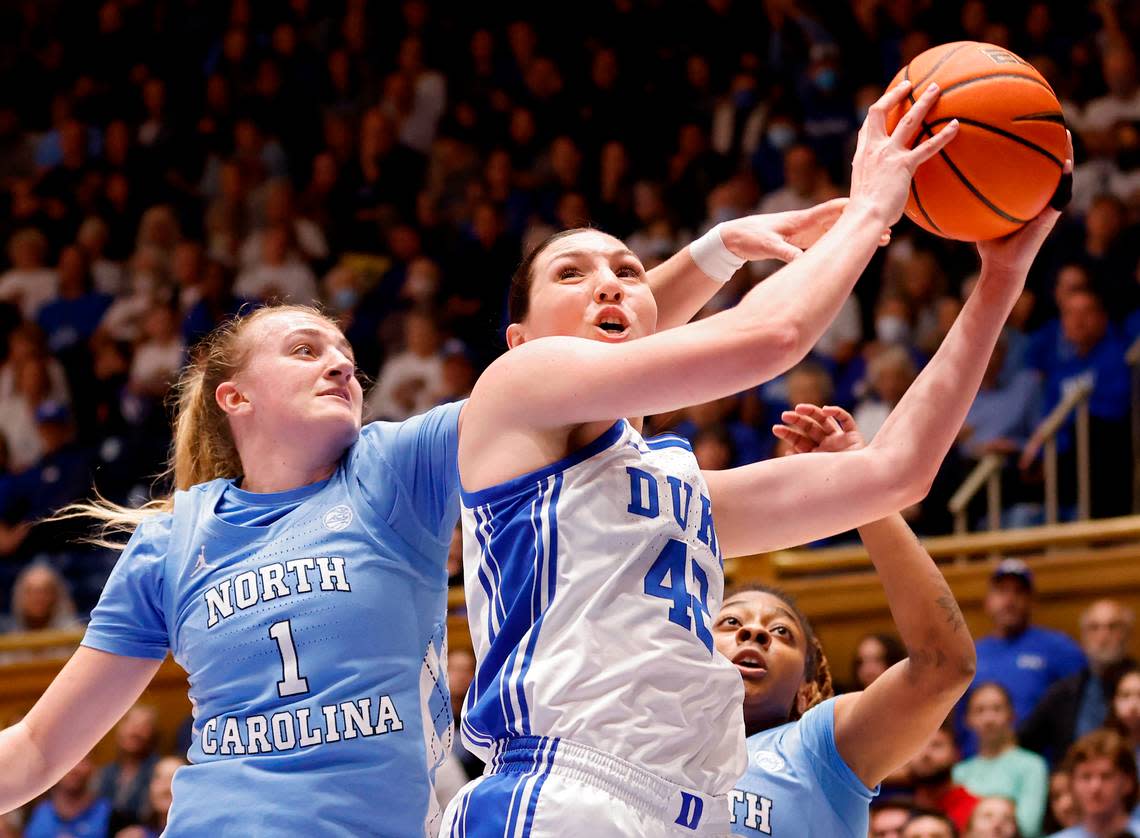 Duke’s Mia Heide pulls down a rebound in front of North Carolina’s Alyssa Ustby and Kayla McPherson during the first half of North Carolina’s 45-41 win over Duke on Sunday, Feb. 26, 2023, at Cameron Indoor Stadium in Durham, N.C.