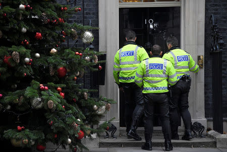 Motorcycle police officers wait to enter 10 Downing Street, London, Britain, December 6, 2017. REUTERS/Toby Melville