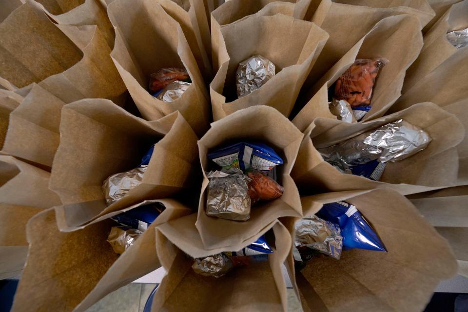 Bagged lunches await stapling before being distributed to students at the county's Tri-Plex Campus involving the students from the Jefferson County Elementary School, the Jefferson County Upper Elementary School and the Jefferson County Junior High School on Wednesday, March 3, 2021 in Fayette. As one of the most food insecure counties in the United States, many families and their children come to depend on the free meals as a means of daily sustenance.