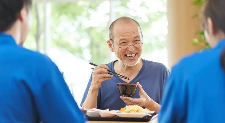 Elderly people enjoying lunch together