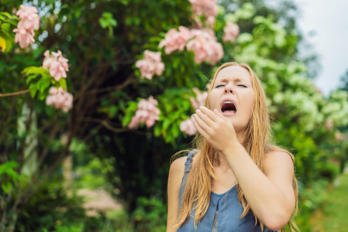 woman sneezing