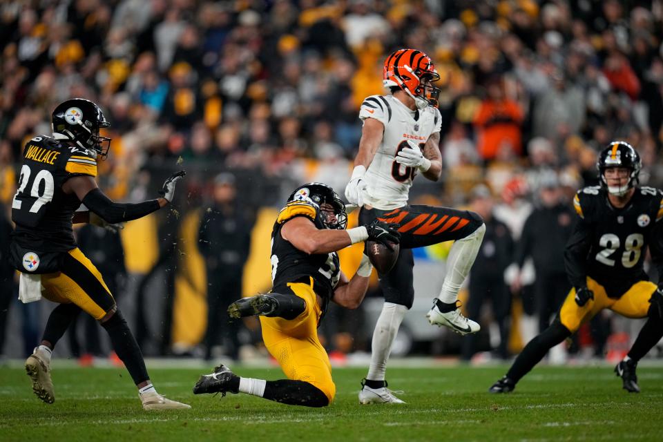 Pittsburgh Steelers linebacker Alex Highsmith (56) intercepts a pass intended for Cincinnati Bengals wide receiver Andrei Iosivas (80) in the fourth quarter of the NFL 16 game between the Pittsburgh Steelers and the Cincinnati Bengals at Acrisure Stadium in Pittsburgh on Saturday, Dec. 23, 2023. The Steelers won 34-11.