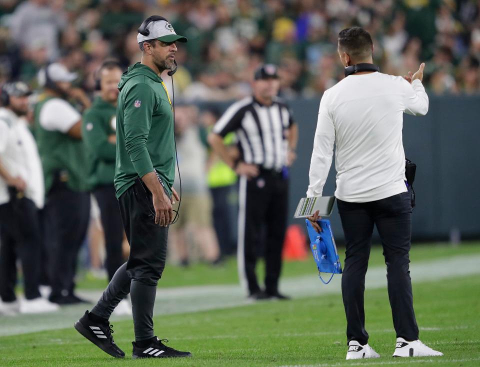 Green Bay Packers quarterback Aaron Rodgers talks with head coach Matt LaFleur during the preseason game against the New Orleans Saints on Friday at Lambeau Field.