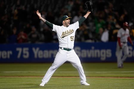 May 7, 2019; Oakland, CA, USA; Oakland Athletics starting pitcher Mike Fiers (50) celebrates after pitching a no hitter against the Cincinnati Reds at Oakland Coliseum. Mandatory Credit: Stan Szeto-USA TODAY Sports