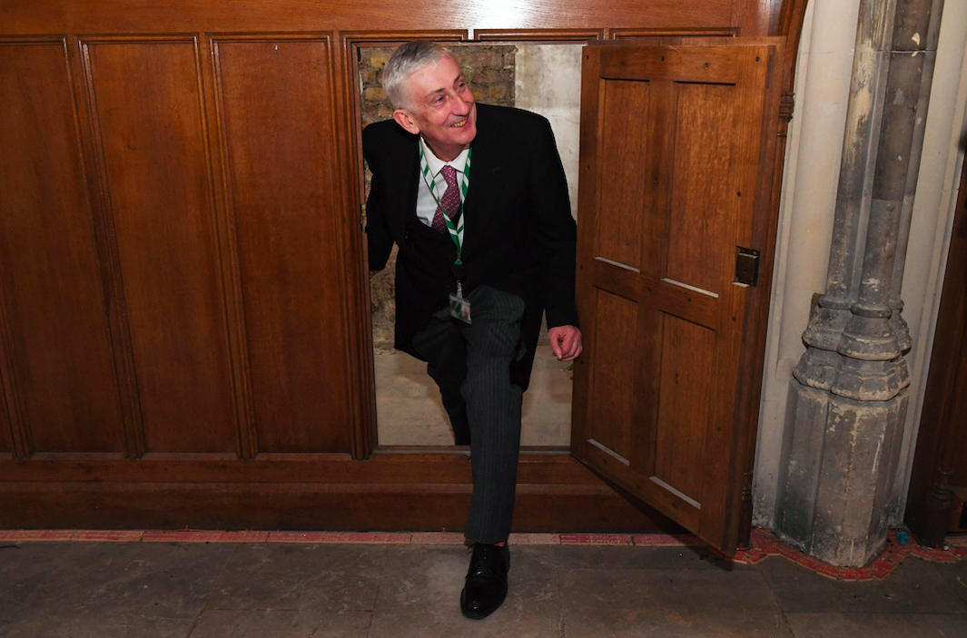 Speaker of the House of Commons Lindsay Hoyle being shown a secret doorway that has been rediscovered in the House of Commons. (PA)