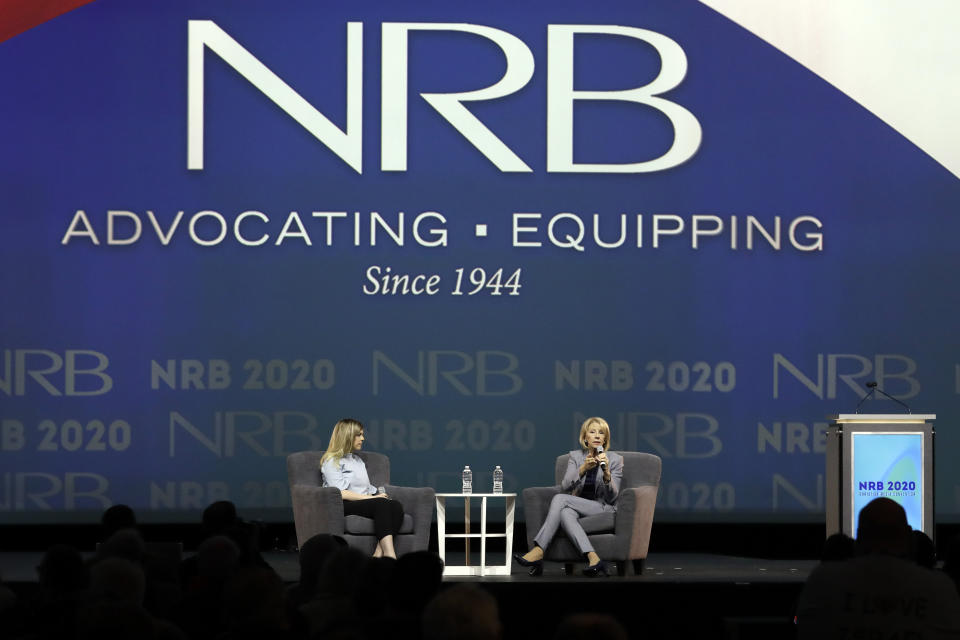 Education Secretary Betsy DeVos, right, speaks at the National Religious Broadcasters Convention Wednesday, Feb. 26, 2020, in Nashville, Tenn. At left is moderator Allie Stuckey. (AP Photo/Mark Humphrey)