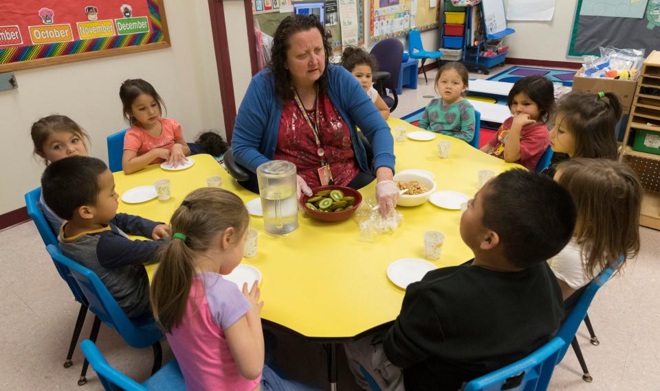 Head Start teacher Lisa Hyde serves snacks to her students Wednesday, Jan.  9, 2019, on the Oneida Indian Reservation in Oneida. The tribe is faring better with the shutdown of the federal government than other tribes because of planning done in the wake of the 2013 shutdown. Head Start is a federally funded program.