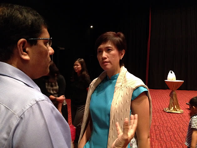 Minister of State for Finance and Transport Josephine Teo speaks to a REACH pre-Budget 2013 forum participant. (Yahoo! photo)