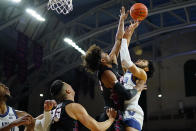 Villanova's Caleb Daniels, right, goes up for a shot against Pennsylvania's Lucas Monroe during the first half of an NCAA college basketball game, Wednesday, Dec. 1, 2021, in Philadelphia. (AP Photo/Matt Slocum)