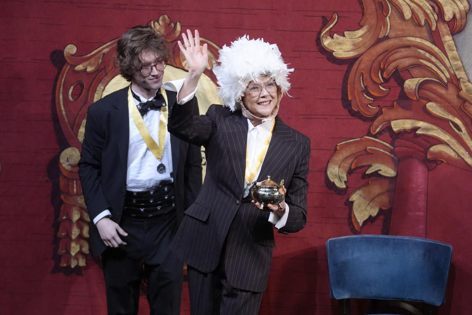 Actor Annette Bening, Hasty Pudding 2024 Woman of the Year, holds the Pudding Pot while wearing a costume of a seagull as she participates in a skit during a roast at Fargas Hall theater, Tuesday, Feb. 6, 2024, in Cambridge, Mass. The award was presented to Bening by Hasty Pudding Theatricals, a theatrical student society at Harvard University. (AP Photo/Steven Senne)