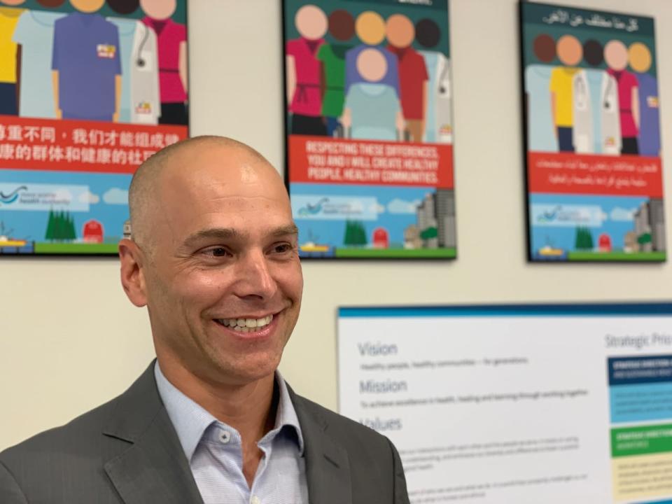 Dr. Tim Holland, medical lead of the newcomers health clinic in Halifax, is all smiles following a funding announcement on Tuesday.