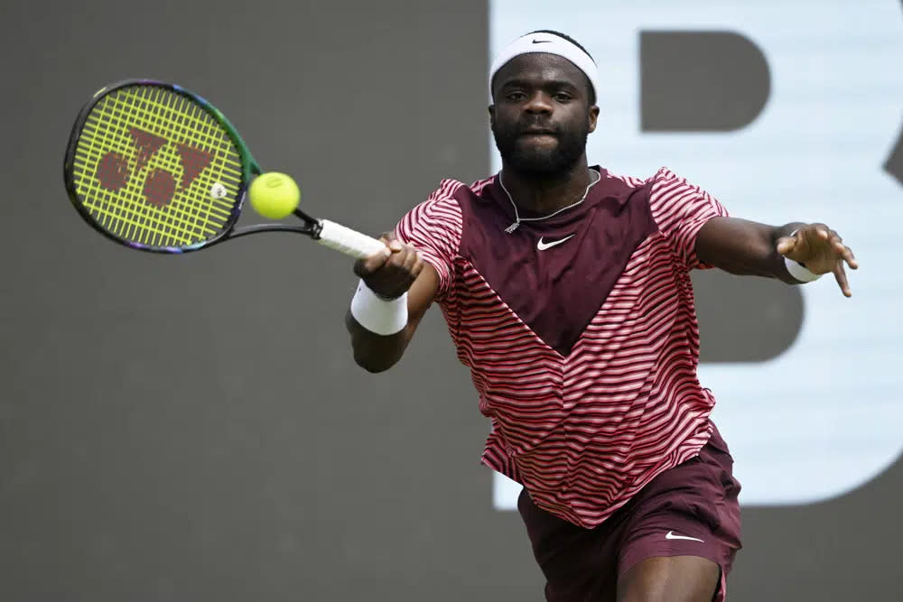 United States’ Frances Tiafoe returns the ball to Hungary’s Marton Fucsovics during a semi-final match of the Stuttgart Open, in Stuttgart, Germany, Saturday, June 17, 2023. Tiafoe won 6-3, 7-6 (11). (Marijan Murat/dpa via AP)