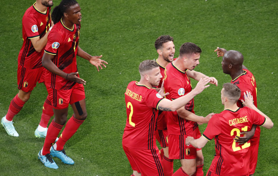 Belgium's Romelu Lukaku, right, celebrates after scoring his sides first goal during the Euro 2020 soccer championship group B match between Russia and Belgium at the Saint Petersburg stadium in St. Petersburg, Russia, Saturday, June 12, 2021. (Anton Vaganov/Pool via AP)