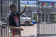 LA CAN outreach worker and human rights organizer, Steve Richardson, who goes by General Dogon, describes the open door policy of his organization in the Skid Row area of Los Angeles Friday, July 22, 2022. In Los Angeles, which is down 650 officers from its pre-pandemic staffing, units that deal with homeless outreach and animal cruelty are shuttered and human trafficking, narcotics and gun details have been downsized. (AP Photo/Damian Dovarganes)