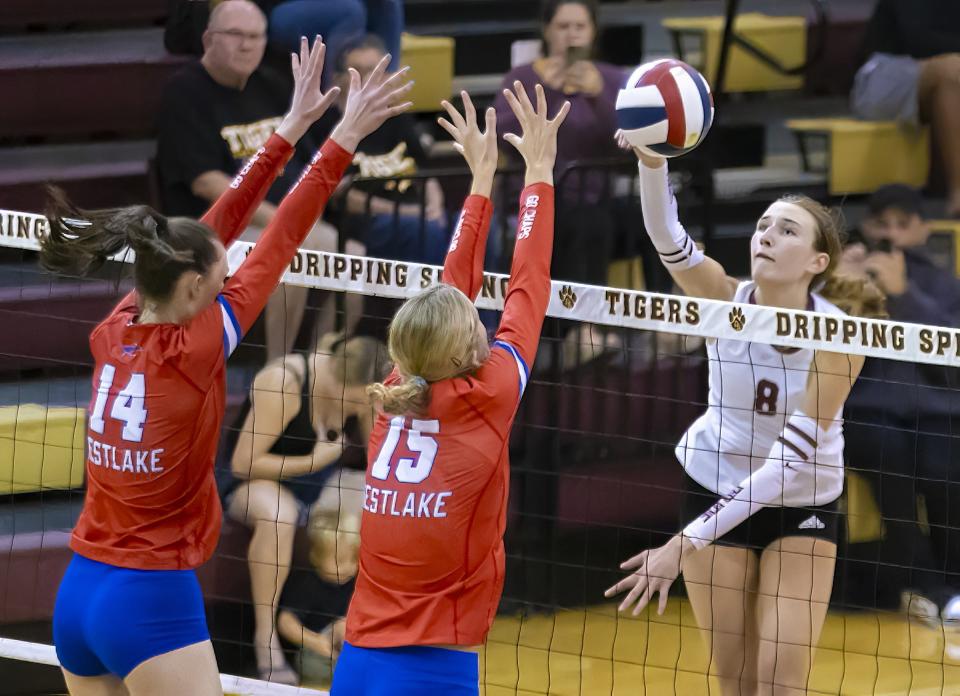 Dripping Springs setter Sydney Lund delivers a shot against Westlake. The sophomore likes her team's chemistry and closeness, and she thinks that's a key factor in the school's volleyball consistency.