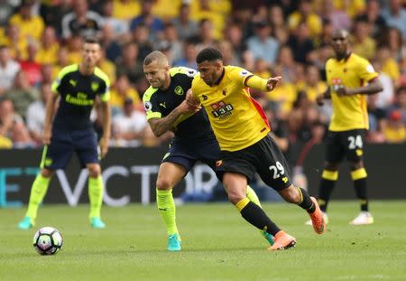 Football Soccer Britain - Watford v Arsenal - Premier League - Vicarage Road - 27/8/16. Watford's Etienne Capoue in action with Arsenal's Jack Wilshere Action Images via Reuters / Andrew Boyers. Livepic