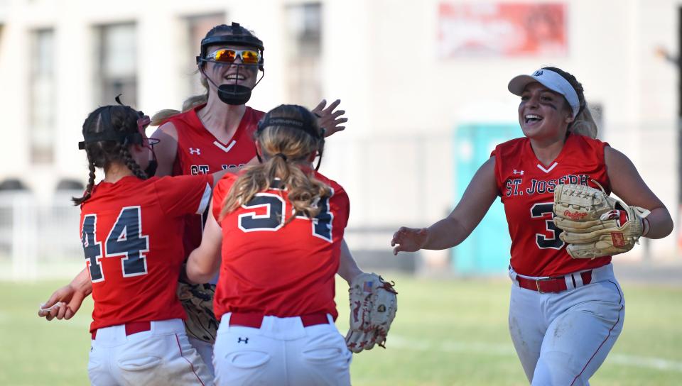 The St. Joseph Academy softball team celebrates with pitcher Ava Fisher (66) after defeating visiting Gloucester Catholic to win the Non-Public B South championship on Tuesday. The Wildcats defeated Gloucester Catholic 3-2 to win their third straight title. May 31, 2022.