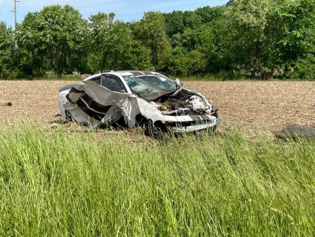 A stolen Dodge Charger is shown after it crashed Thursday on U.S. Route 36 east of Robin Road in Clay Township. The car was traveling up to 163 mph, according to Tuscarawas County Sheriff Orvis Campbell.