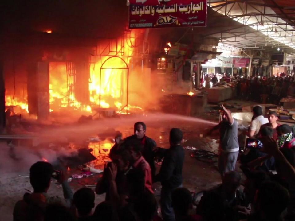 Still from a video shows multiple market stalls on fire during the blaze at Nabi Yunus market in east Mosul, Iraq, on Sunday, 26 March (AP)