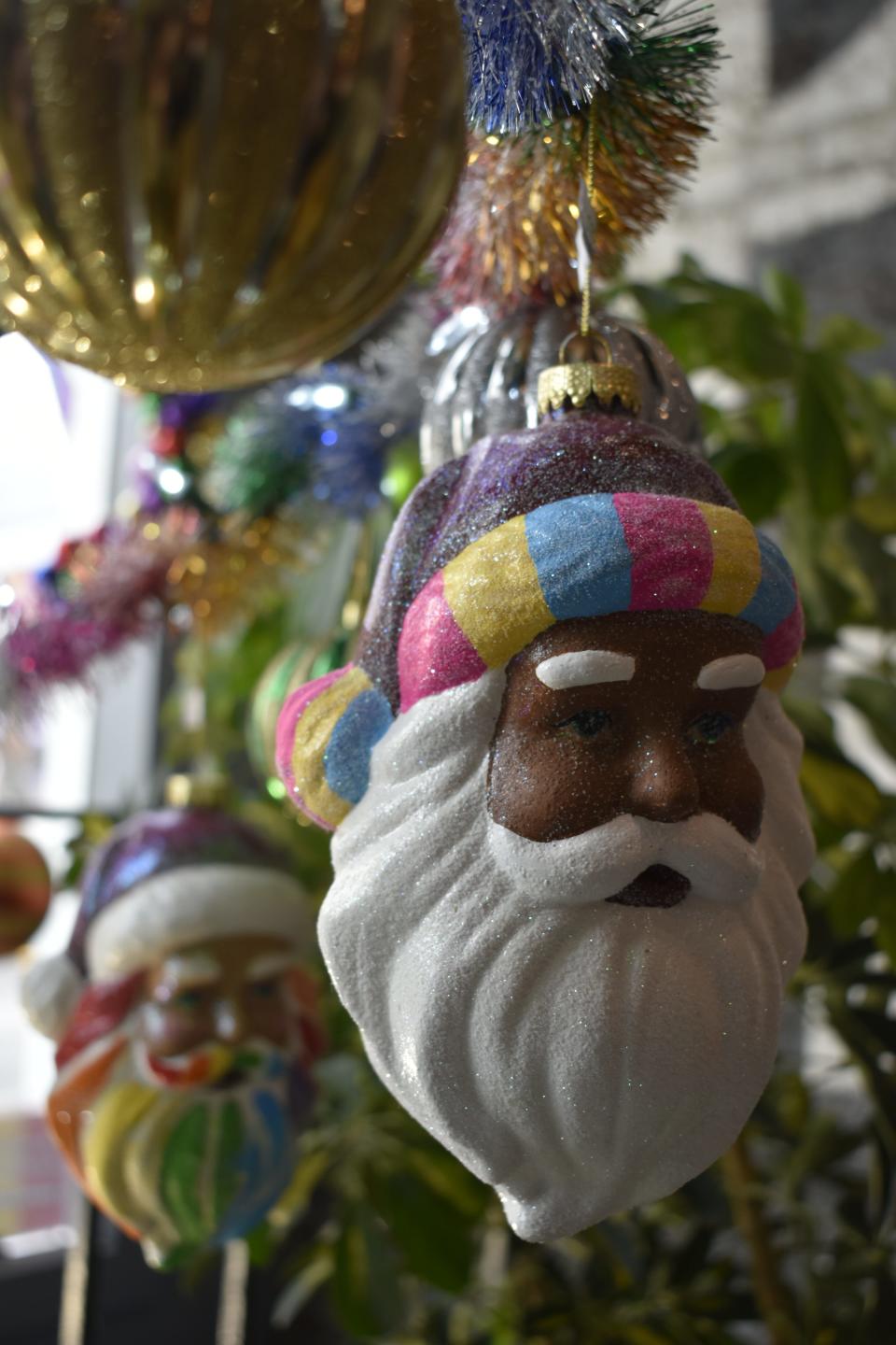 Hand-painted Santa head ornaments on sale at the CommUnityCenter in downtown Spencer.