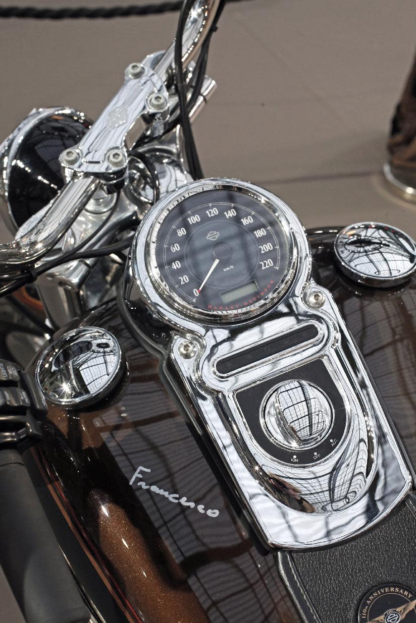 The 2013 Harley DavidsonSuper Glide Custom A 1,585cc Harley-Davidson Dyna Super Glide, donated to Pope Francis last year and signed by him on its tank, is displayed ahead of Bonham's sale of vintage and classic cars, at the Grand Palais in Paris, Wednesday, Feb. 5, 2014. The bike will be sold at auction to help raise funds for a soup kitchen and hostel for the homeless in Rome. (AP Photo/Thibault Camus)