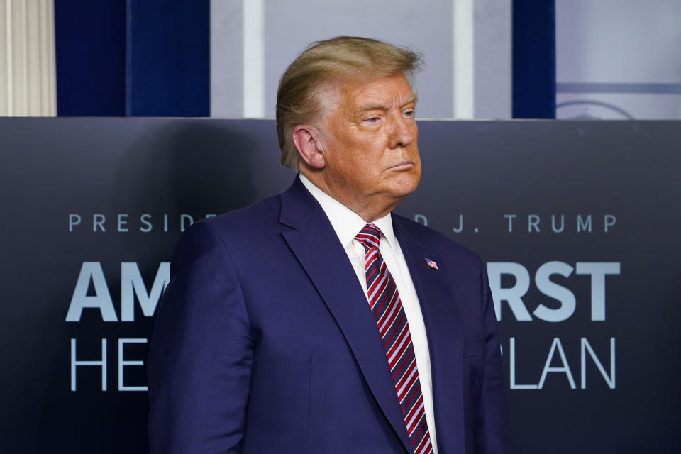 FILE - In this Nov. 20, 2020, file photo President Donald Trump listens during a news conference in the briefing room at the White House in Washington. (AP Photo/Susan Walsh, File)