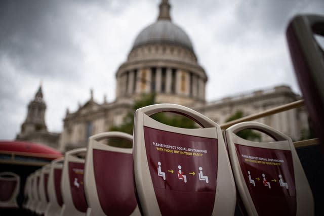 Tourists on a near empty top deck on the London Big Bus open-top tour (Aaron Chown/PA)