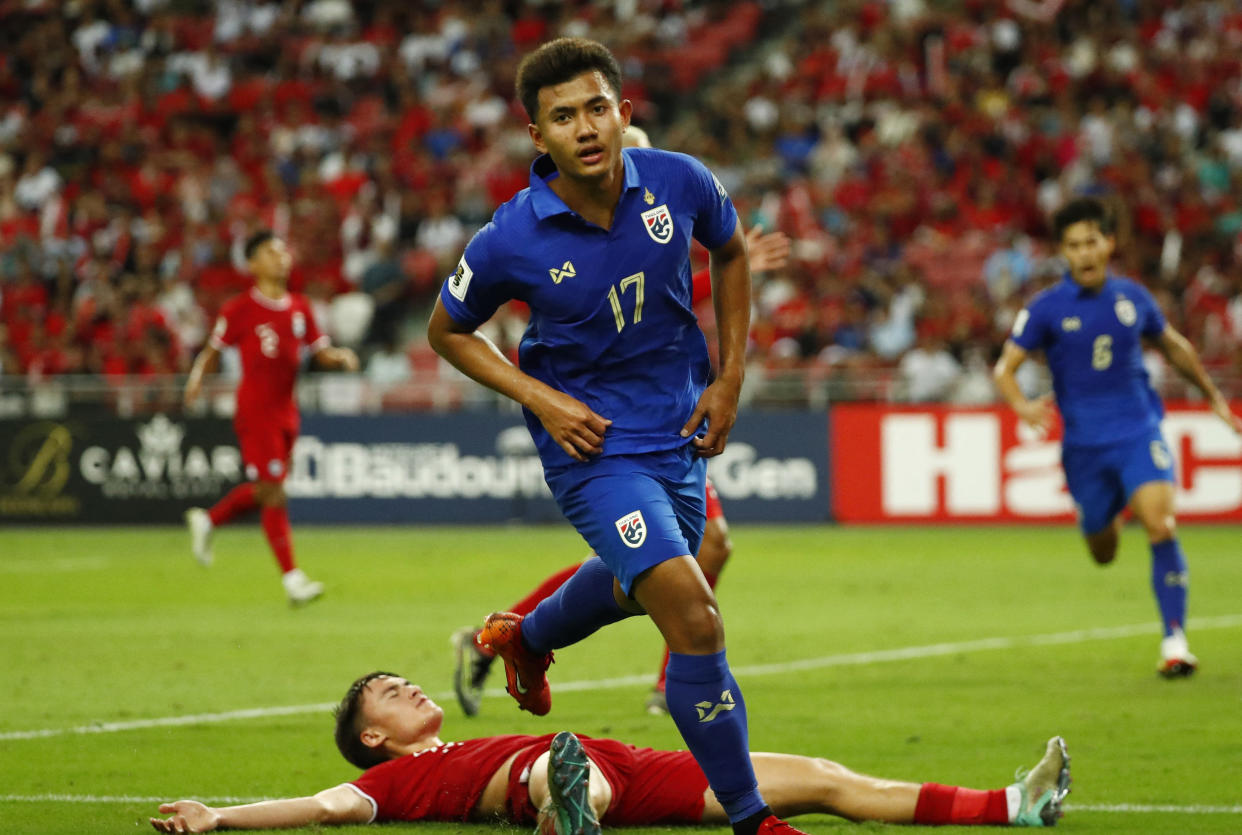 Thailand's Suphanat Mueanta celebrates scoring their second goal against Singapore in their 2026 World Cup qualifier at Singapore National Stadium.