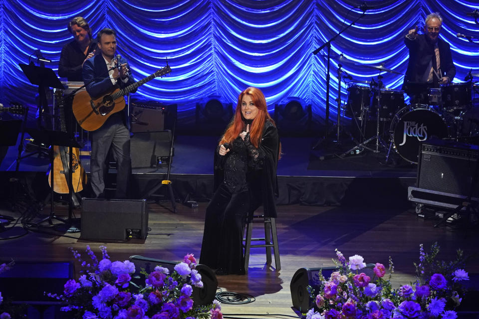 Wynonna Judd speaks during a tribute to her mother, country music star Naomi Judd, Sunday, May 15, 2022, in Nashville, Tenn. Naomi Judd died April 30. She was 76. (AP Photo/Mark Humphrey)