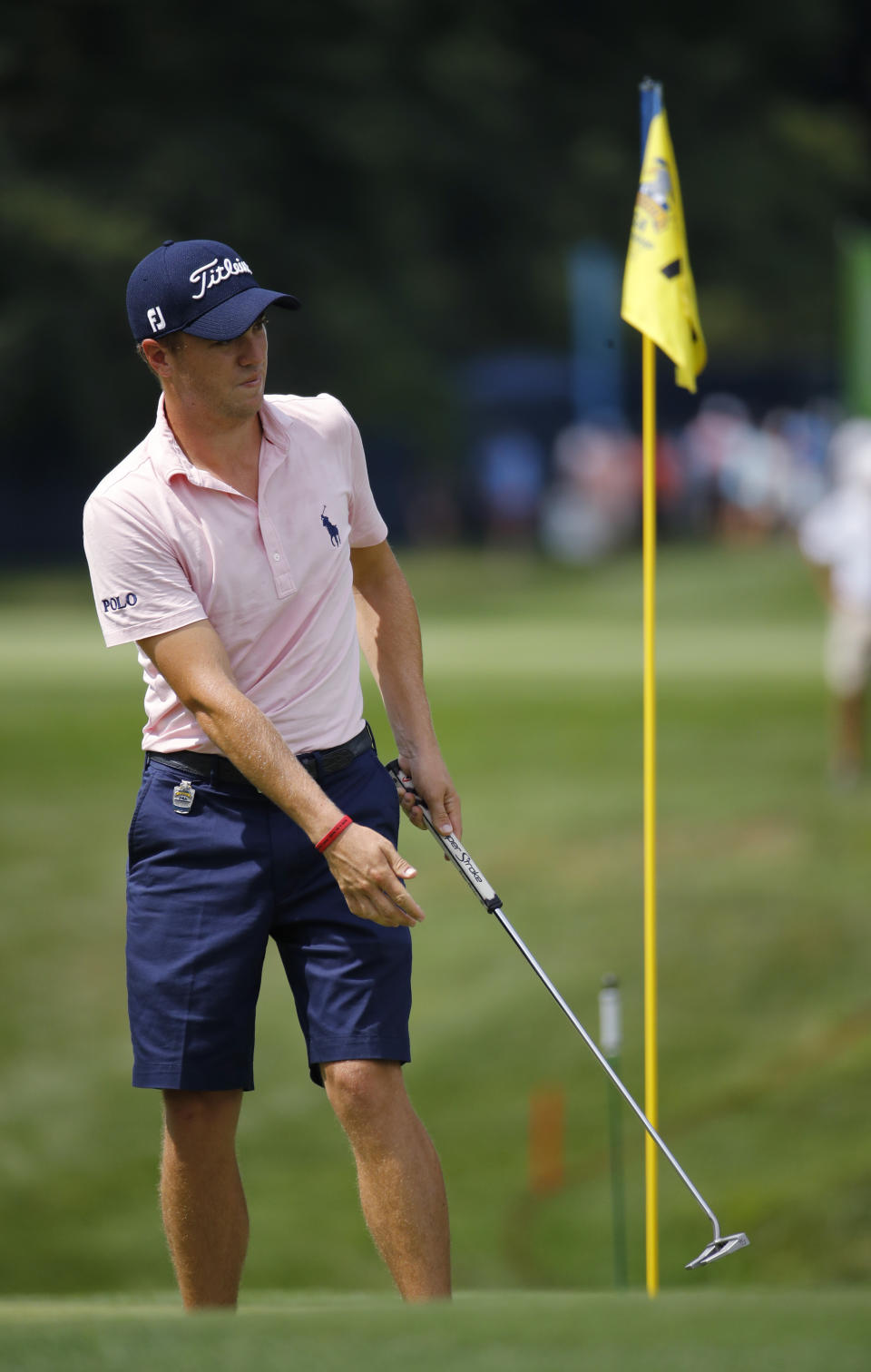 Justin Thomas watches his putt on the 14th green during a practice round for the PGA Championship golf tournament at Bellerive Country Club, Wednesday, Aug. 8, 2018, in St. Louis. (AP Photo/Charlie Riedel)