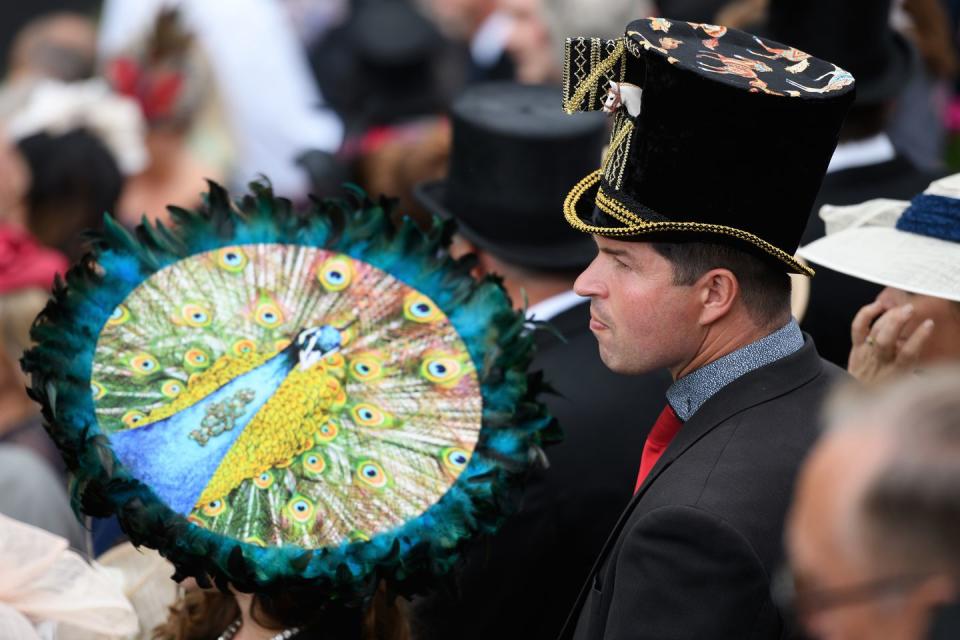 <p>One spectator wore a detailed peacock headpiece.</p>