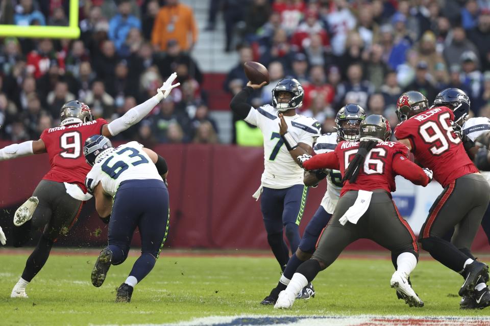 Seattle Seahawks quarterback Geno Smith (7) throws during the first half of an NFL football game against the Tampa Bay Buccaneers, Sunday, Nov. 13, 2022, in Munich, Germany. (AP Photo/Gary McCullough)