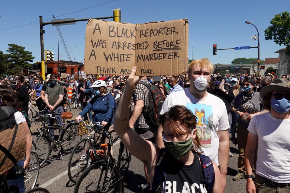 Minneapolis demonstrators protest the killing of George Floyd. A police officer has been charged with murder over his death.