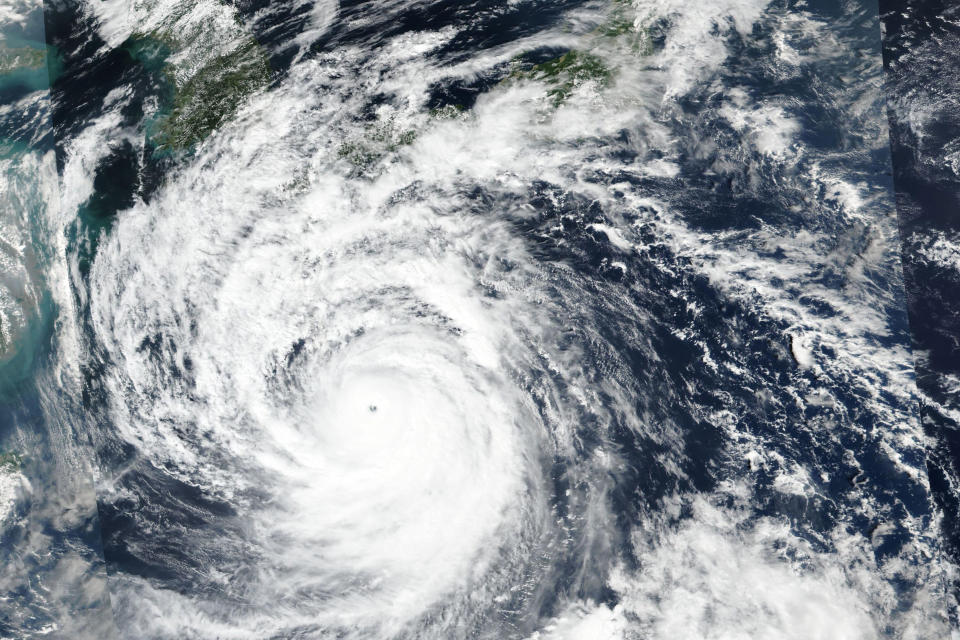 This Saturday, Sept. 17, 2022 satellite image released by NASA shows Typhoon Nanmadol, which is approaching southwest Japan. (NASA Worldview, Earth Observing System Data and Information System (EOSDIS) via AP)