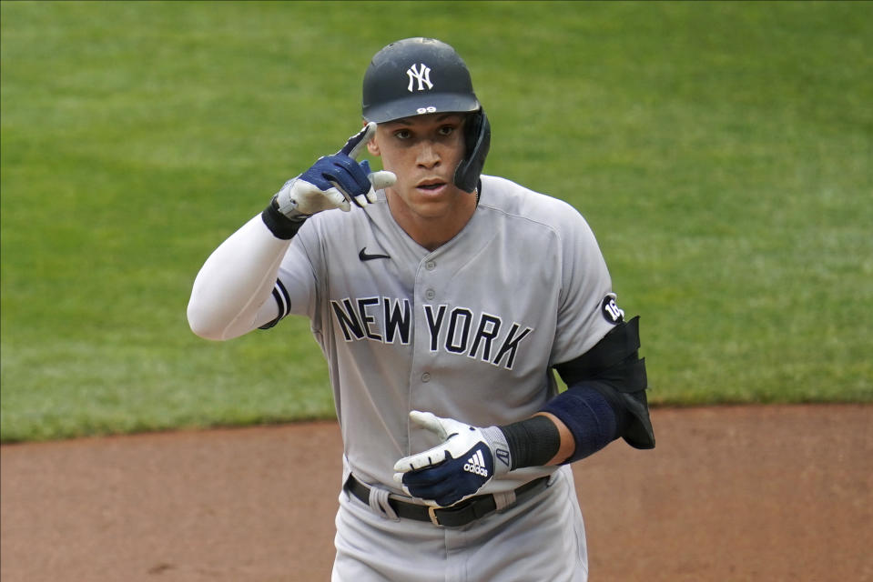 New York Yankees' Aaron Judge heads to the dugout after his solo home run off Minnesota Twins pitcher Randy Dobnak during the first inning of a baseball game Wednesday, June 9, 2021, in Minneapolis. (AP Photo/Jim Mone)