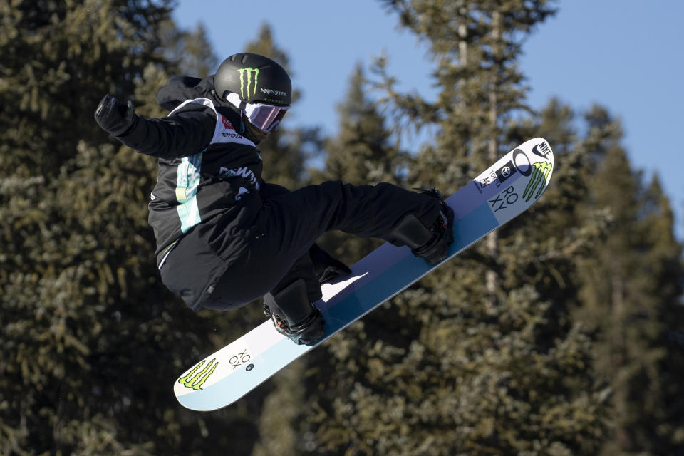 FILE - Chloe Kim, of the United States, executes a trick in the snowboarding halfpipe finals, Sunday, Dec. 19, 2021, during Dew Tour at Copper Mountain, Colo. Shaun White is likely heading to the Olympics for a fifth time. For the first time, the snowboarding star and three-time gold medalist on the halfpipe won't be the favorite. That won't be the case on the women's side, where Chloe Kim will attempt to defend the gold that she claimed with such ease in Korea four years ago. (AP Photo/Hugh Carey, File)