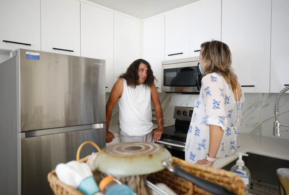 Hope Shaw talks with Bruce Blackham in his new apartment in San Diego.