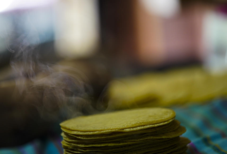 Steam rises from a batch of freshly organic native corn tortillas at a hardware store in the Condesa neighborhood of Mexico City, Wednesday, May 24, 2023. Some Mexican farmers are finding a niche but increasing market among consumers seeking organic produce from small-scale growers and chefs worldwide. (AP Photo/Fernando Llano)