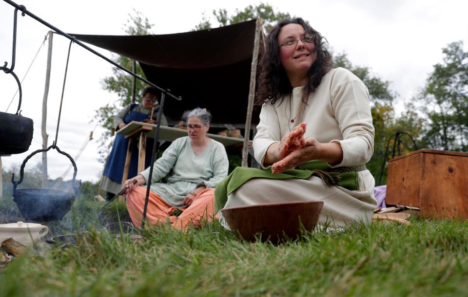 Audrey Lucero of Michigan makes meatballs during last year's Midwest Viking Festival at the University of Wisconsin-Green Bay. The free event returns for its third year on Oct. 6 and 7.