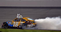 RICHMOND, VA - APRIL 28: Kyle Busch, driver of the #18 M&M's Ms. Brown Toyota, celebrates with a burnout after winning the NASCAR Sprint Cup Series Capital City 400 at Richmond International Raceway on April 28, 2012 in Richmond, Virginia. (Photo by Drew Hallowell/Getty Images)