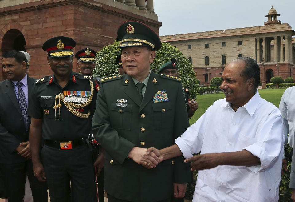 Chinese Defense Minister Liang Guanglie shakes hands with Indian Defense Minister A.K. Antony in New Delhi, India, Tuesday, Sept. 4, 2012. Liang is holding talks with his Indian counterpart amid Beijing's growing tensions with its neighbors over territorial claims in the South China Sea. The two ministers are expected to discuss resuming regular military ties and progress made on resolving a Himalayan border dispute that led to a brief war in 1962. (AP Photo/Manish Swarup)