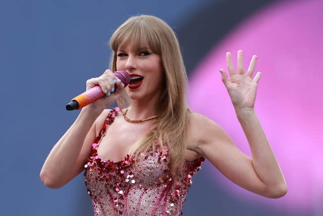 Taylor Swift waves from the stage