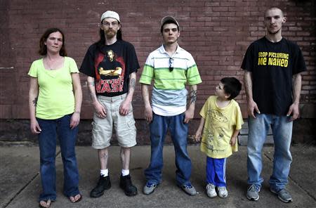 Shamokin's residents (L to R) Jessica Kruleski, 33, Traci Carmen, 34, Gary Parks, 27, Anson Barrett, 5, and Jeff Try, 22, pose for a picture on the street in Shamokin May 1, 2014. REUTERS/Mark Makela