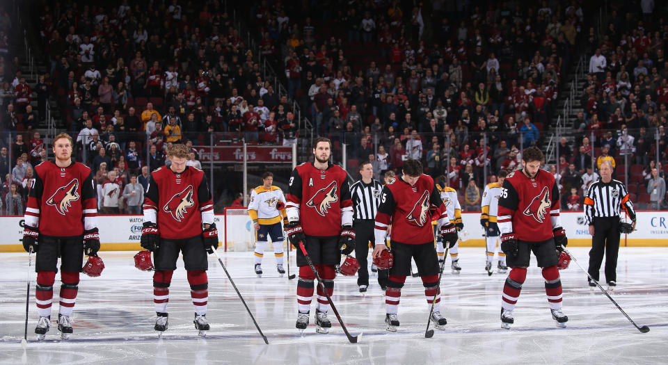 The Arizona Coyotes stand attended for the national anthem before the NHL game against the Nashville Predators at Gila River Arena on January 4, 2018 in Glendale, Arizona. The Coyotes defeated the Predators 3-2 in overtime.  (Photo by Christian Petersen/Getty Images)