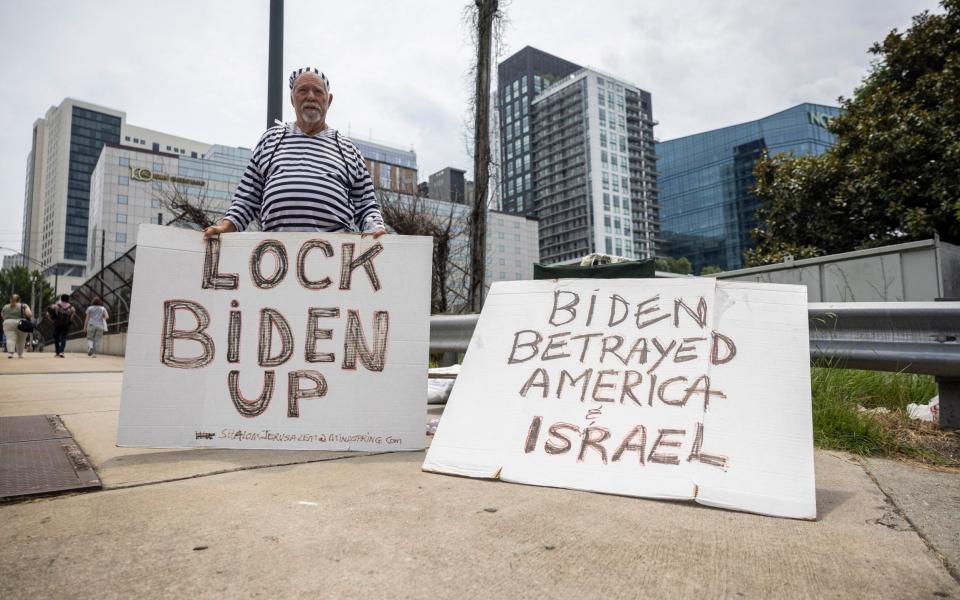 A protester demonstrates near the CNN Center