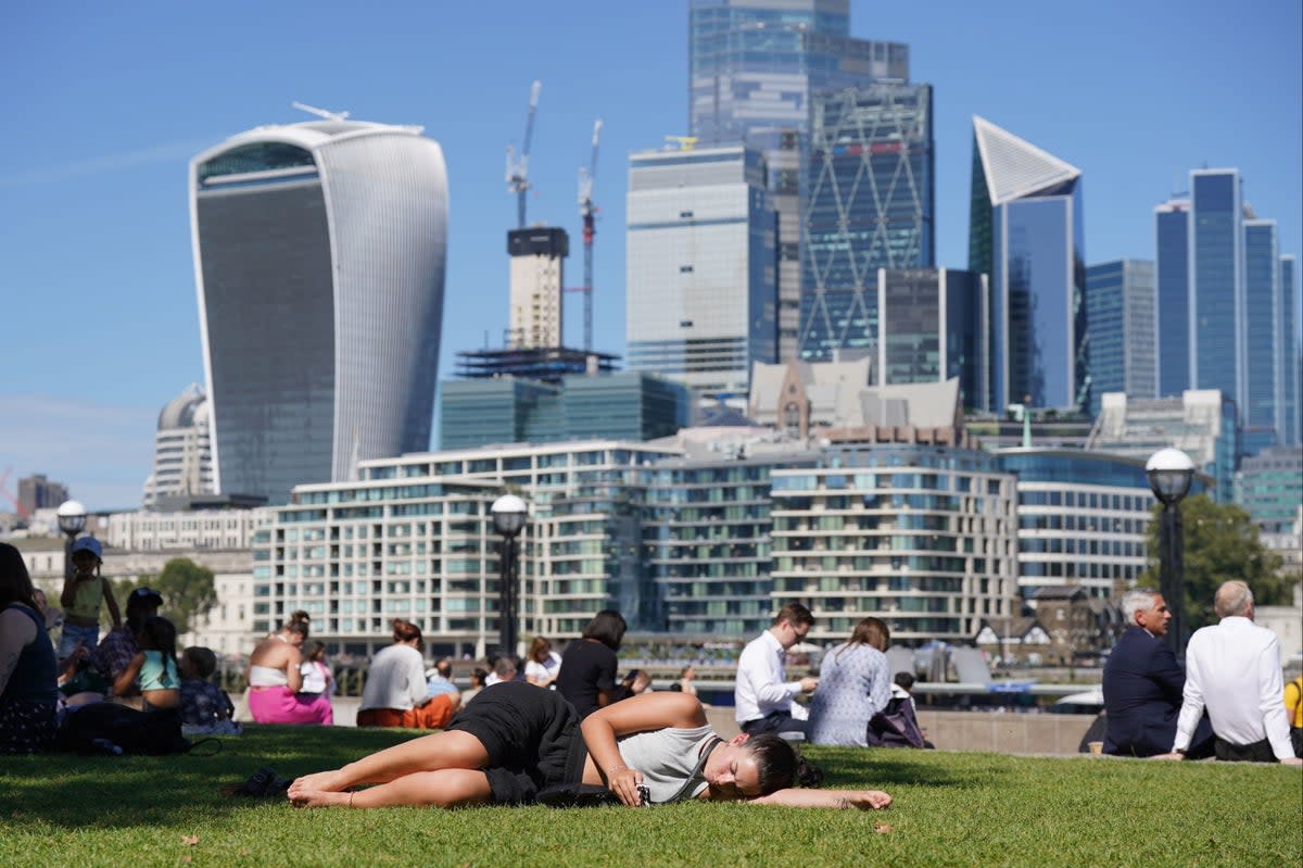 Stock image of Londoners enjoying sunshine in Potter’s Fields Park (PA)